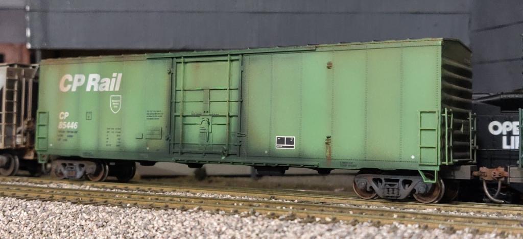 P1K 50 CP Rail 50 newsprint boxcar #85446, with weathered detail.